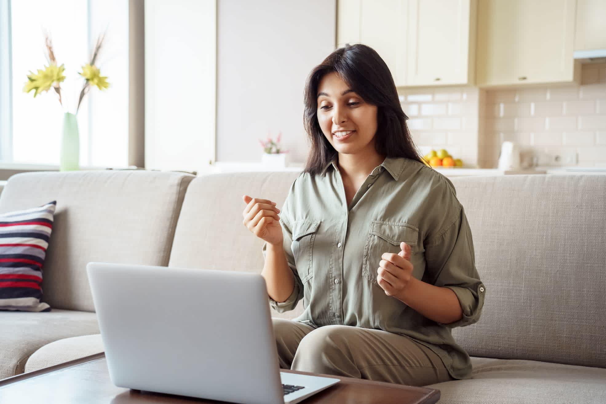 A woman being interviewed online at home