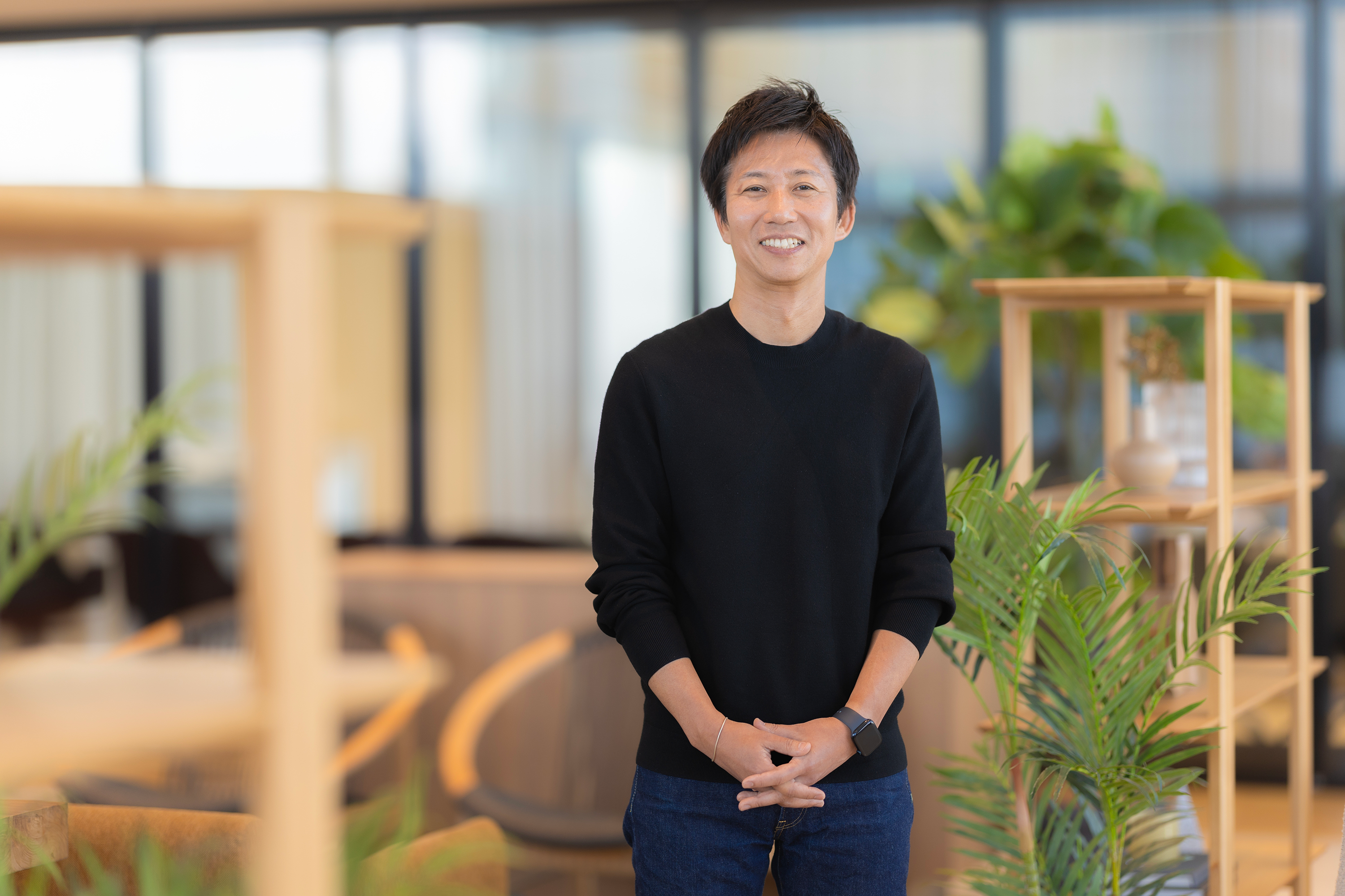 Keiichi Ushida smiling, looking directly into the camera