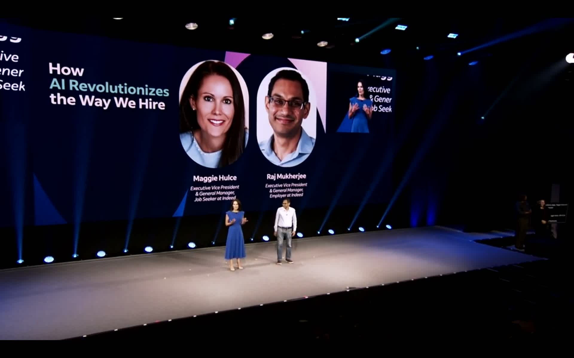 Maggie Hulce, executive vice president and general manager of Enterprise at Indeed, and Raj Mukherjee, executive vice president and general manager for Employer at Indeed giving a speech