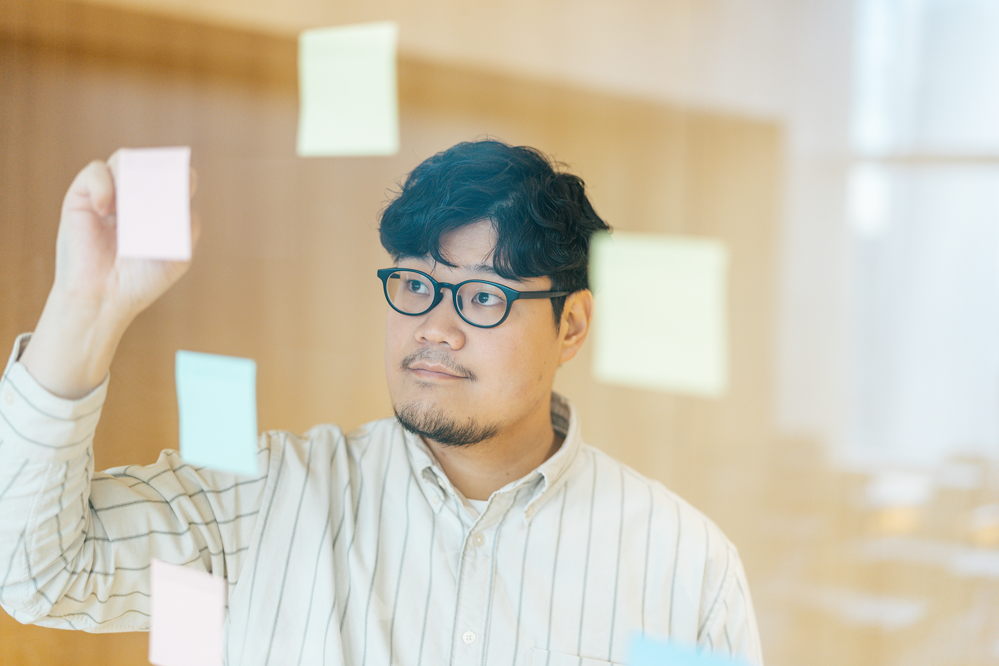 Takafumi Imai brainstorming in the office